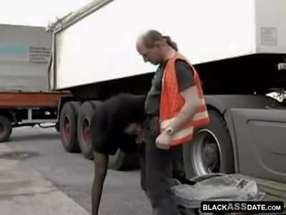 Black bitch riding on grown-up truck driver outside