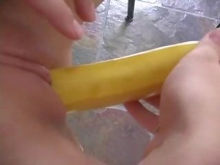 Shaved pussy having fun with a bannana show