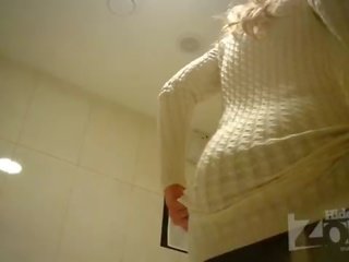Pretty blonde in toilet shaved pussy and anus closeups.